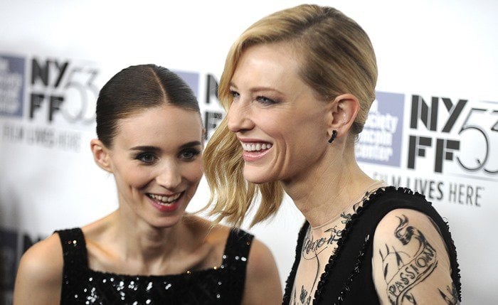 Rooney Mara and Cate Blanchett laugh together on the red carpet at the premiere of their new movie "Carol"