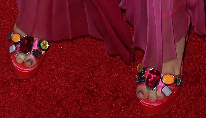 Miley Cyrus wearing pink “Amanda” platform sandals by Sophia Webster