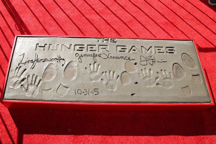 Josh Hutcherson, Jennifer Lawrence, and Liam Hemsworth at "The Hunger Games: Mockingjay — Part 2" cast hand and footprint ceremony