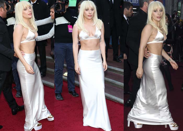 Lady Gaga paired her eccentric ensemble with white platform heels that had multiple straps and a gold cap toe