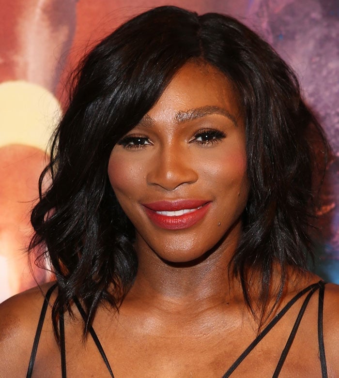 Serena wore her short dark locks in tousled waves and added a pop of color to the look with red lipstick
