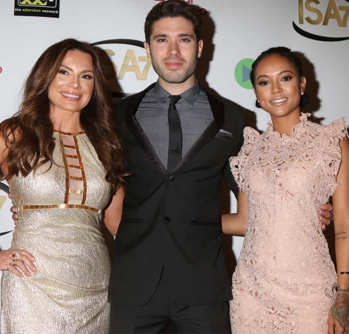 Karrueche Tran poses on the red carpet with fellow actors Lilly Melgar and Kristos Andrews