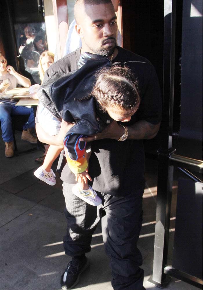 Kanye carries North out as the family left The Cheesecake Factory for lunch