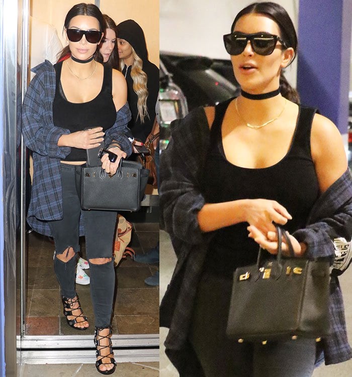 Kim Kardashian in black tank top, J Brand ripped jeans, and Enfants Riches Deprimes checked shirt