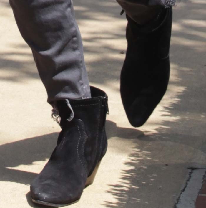 Kourtney Kardashian turns to her favorite Saint Laurent boots for her errand day