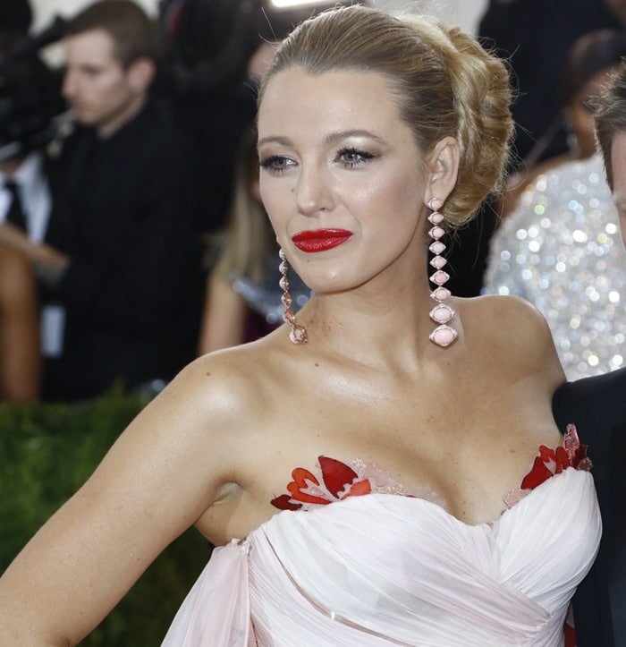 Blake Lively donned a flattering silk and chiffon Burberry gown featuring an extremely long train that extended far behind her