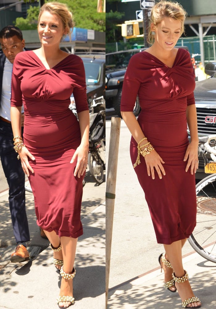 Blake Lively in a red dress by Oscar de la Renta, which showed off her growing baby bump