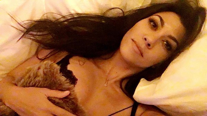 Kourtney Kardashian uploads a morning selfie of her still wearing her lace bra from her night of partying