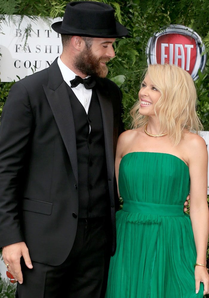 The look of love: Kylie poses with her fiancé on the red carpet