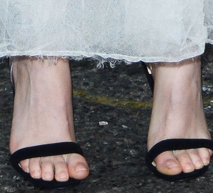 Kristen Stewart in PVC-strapped Christian Louboutin Jonatina illusion sandals