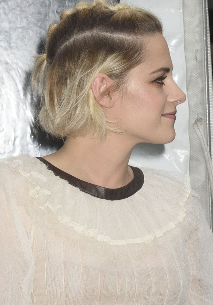 Kristen shows off her unconventional hairstyle to go with her Chanel Fall 2016 dress