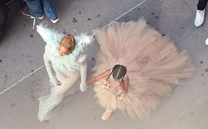 Beyoncé and daughter turn heads in their coordinated outfits as they make their way through the crowd