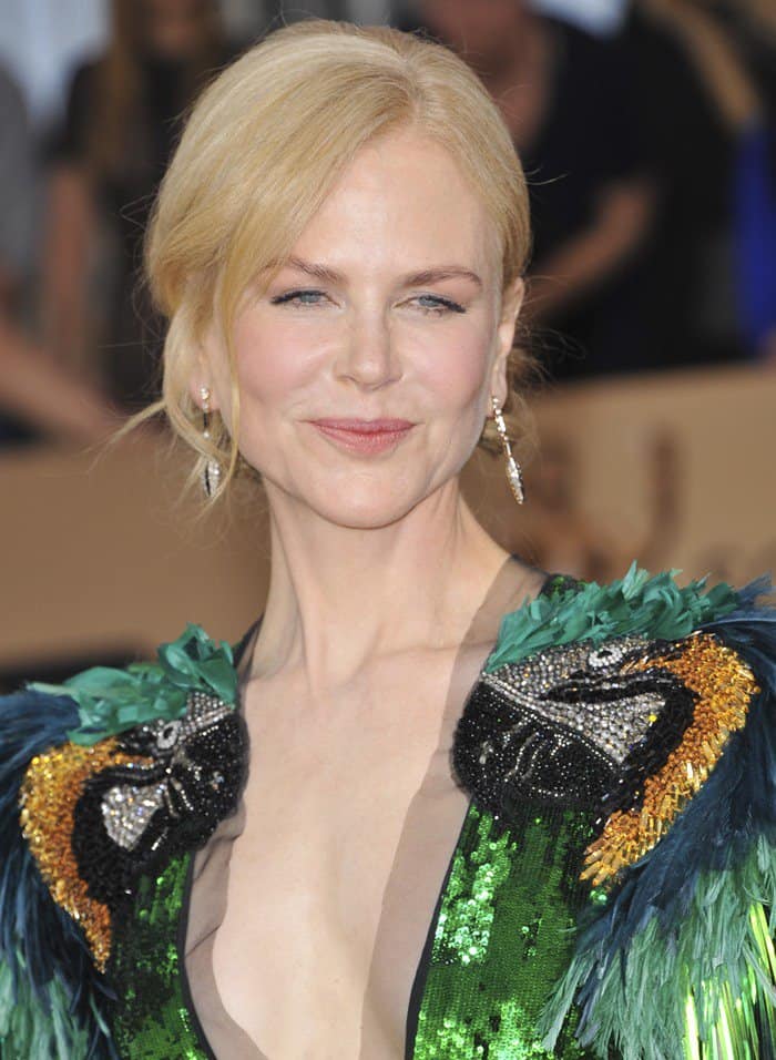 Nicole Kidman wearing a playful green gown with a plunging neckline