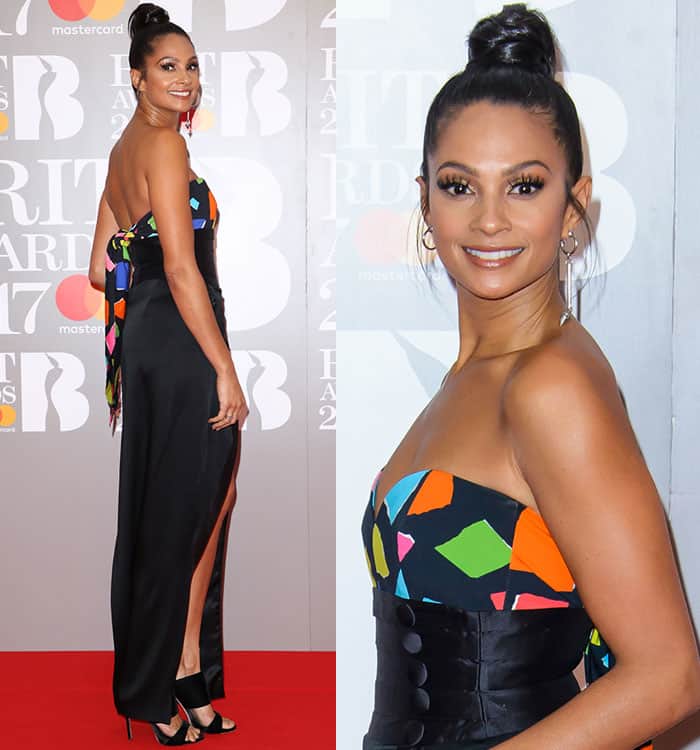 Alesha Dixon wearing a black Ronald Van Der Kemp wrap skirt, a colorful Moschino top, and Giuseppe Zanotti sandals at the 2017 Brit Awards