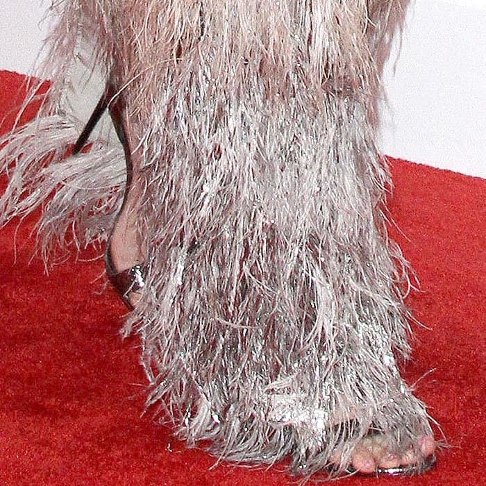 Tom Ford T simple strap sandals peeking from beneath Katy Perry's feathery skirt