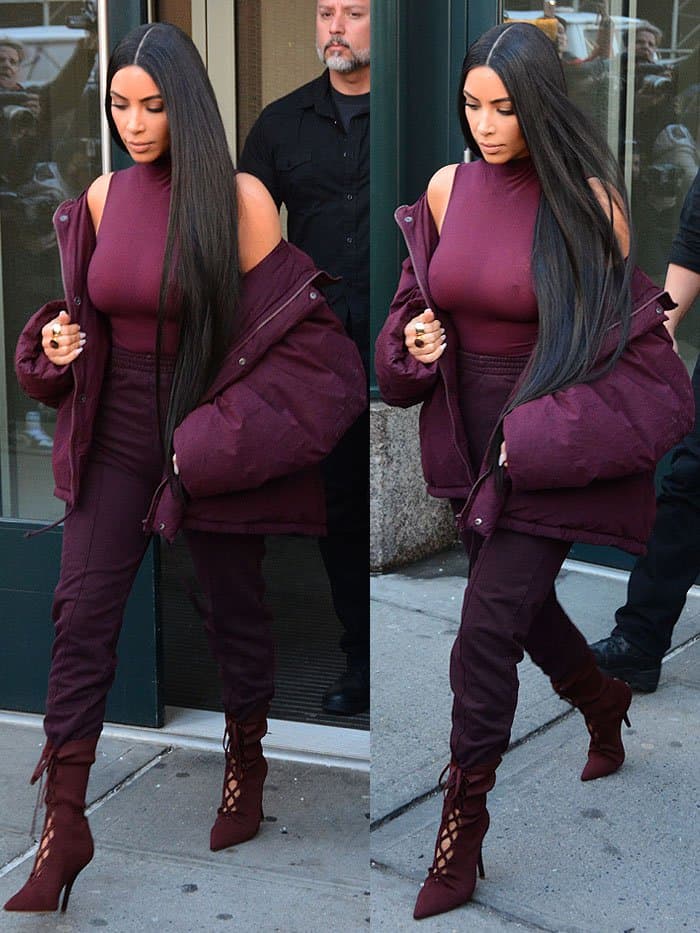 Kim Kardashian completed her look with high-waist sweatpants and favorite lace-up boot style