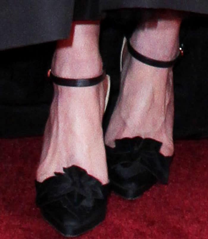Kirsten wears a pair of Christian Lacroix pumps