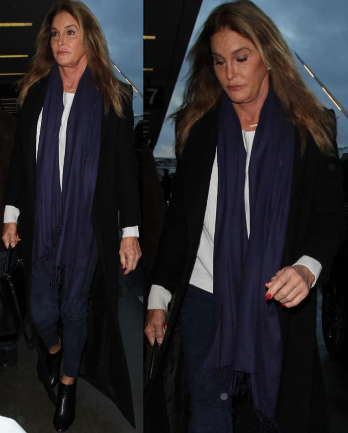 Caitlyn Jenner wearing black leather ankle boots at LAX
