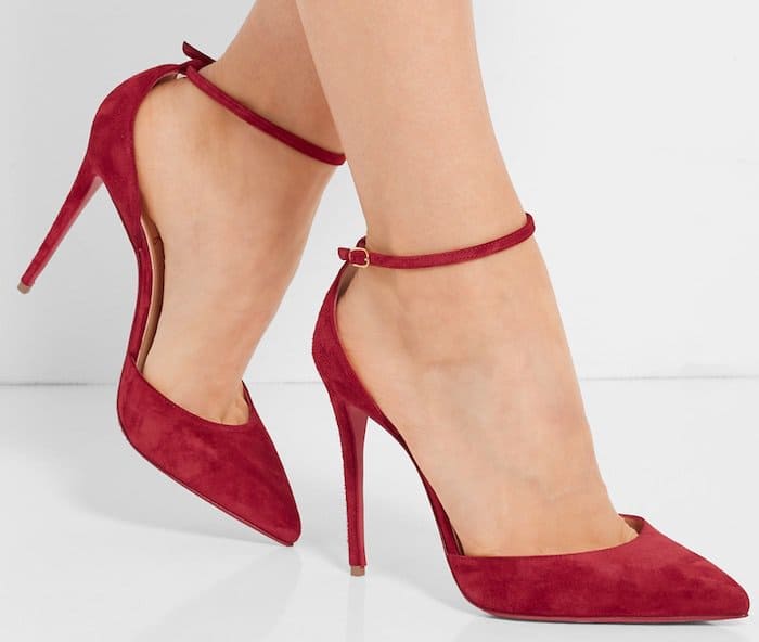 This pair is designed with a slender heel, ankle strap and sleek point-toe silhouette