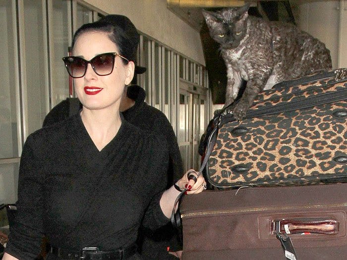 Dita Von Teese traveling with her Devonshire Rex cat named Alestier at the Los Angeles International Airport (LAX) in Los Angeles, California, on March 6, 2017.