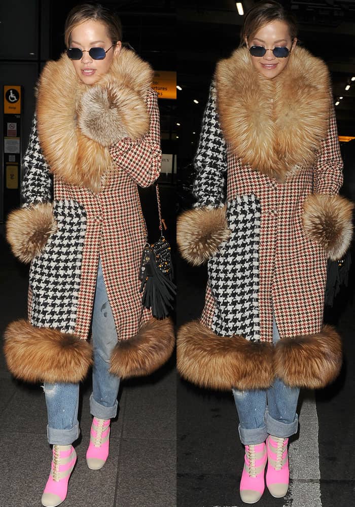 Rita looks like a walking patchwork in her oversized Ellery tweed fur coat and pink Fendi boots