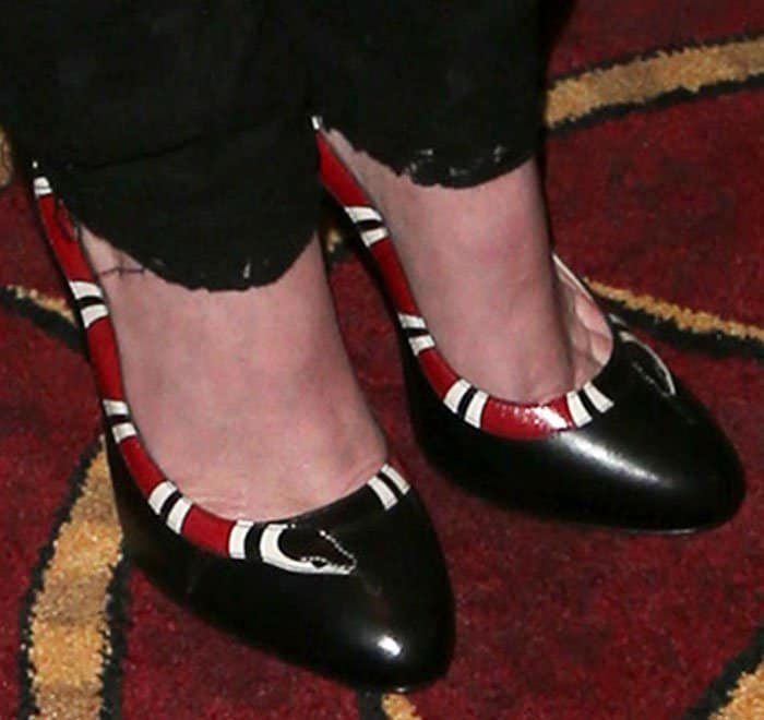 Rumer wears the quirky Yoko snake pumps from Gucci