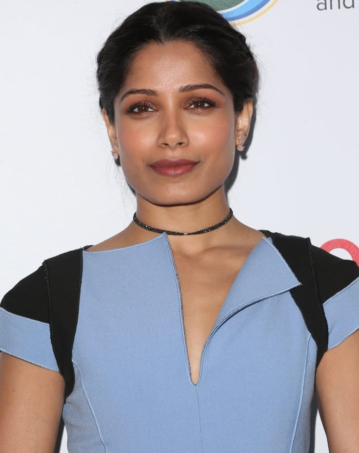 Freida Pinto wearing a blue Amanda Wakeley dress and Rupert Sanderson “Etienne” Moonlight Embellished Satin Pumps at the Innovators for a Healthy Planet Gala