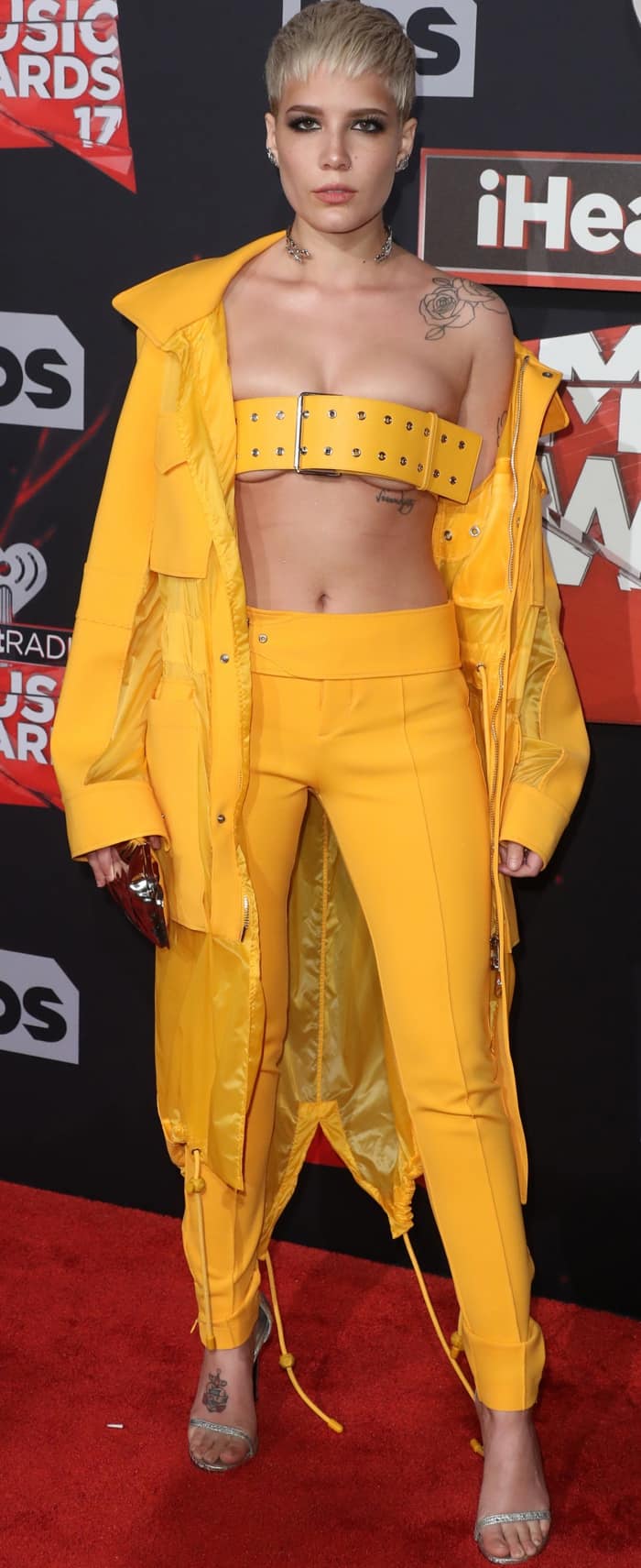 Halsey wearing a yellow Versus Versace look and Stuart Weitzman “Nudistsong” sandals in pearl nappa leather at the 2017 iHeartRadio Music Awards