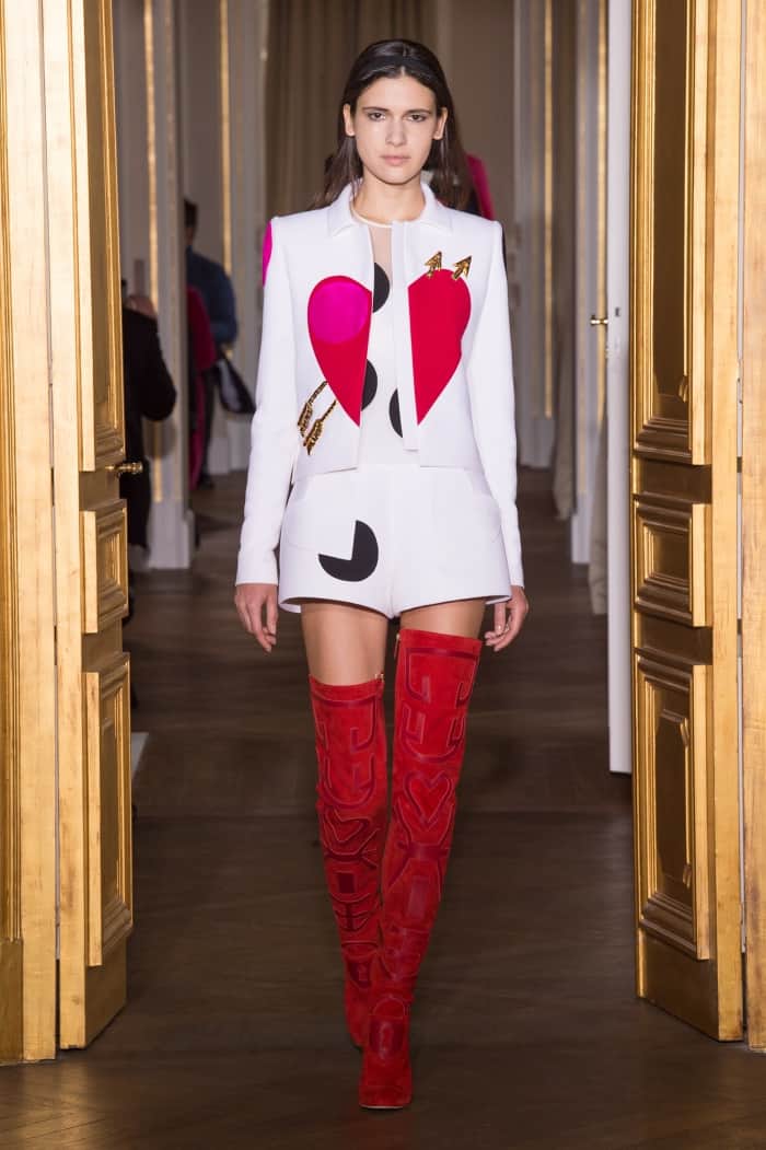 Model wearing the Schiaparelli Mixed-Material “Heart” Thigh-High Boots
