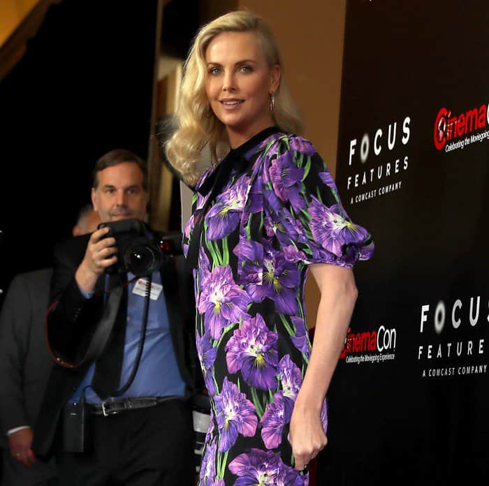 Charlize Theron in a floral Gucci mini dress at CinemaCon 2017 in Las Vegas on March 29, 2017