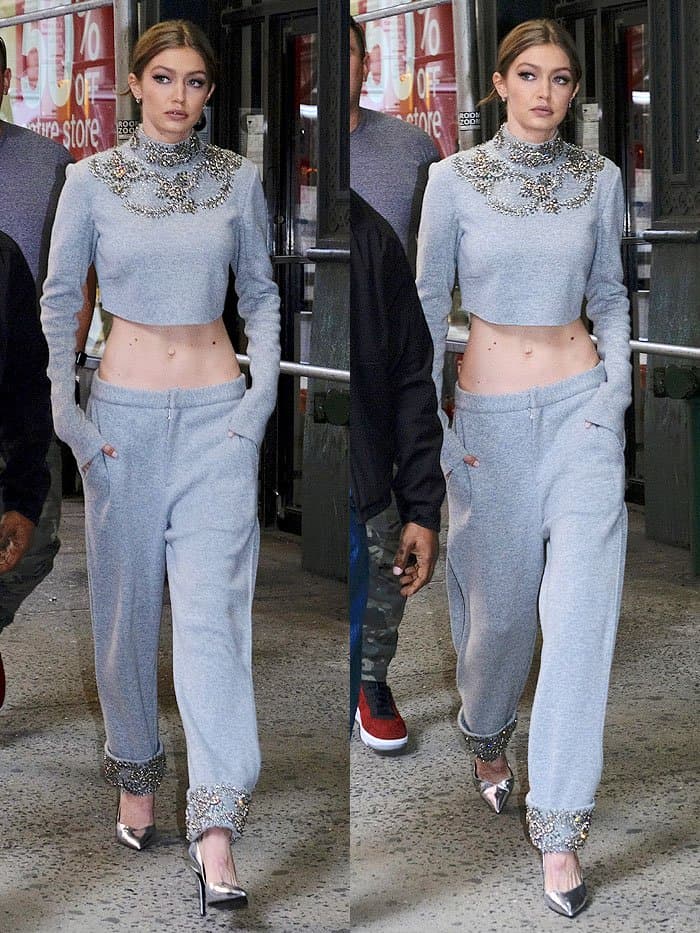 Gigi Hadid in gray embellished crop-top sweatpants leaving a building in SoHo in New York City on April 12, 2017.