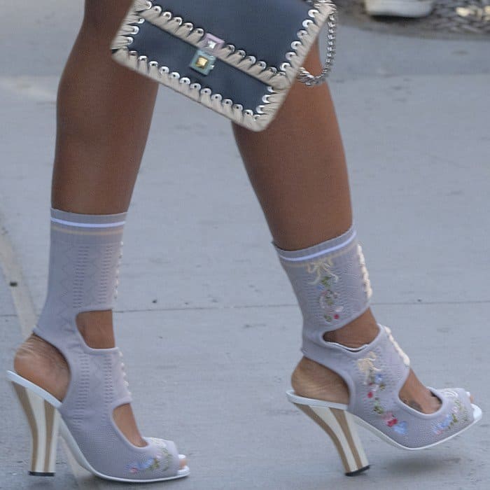 Kelly Rowland wearing stretch-knit ankle sock boots from Fendi