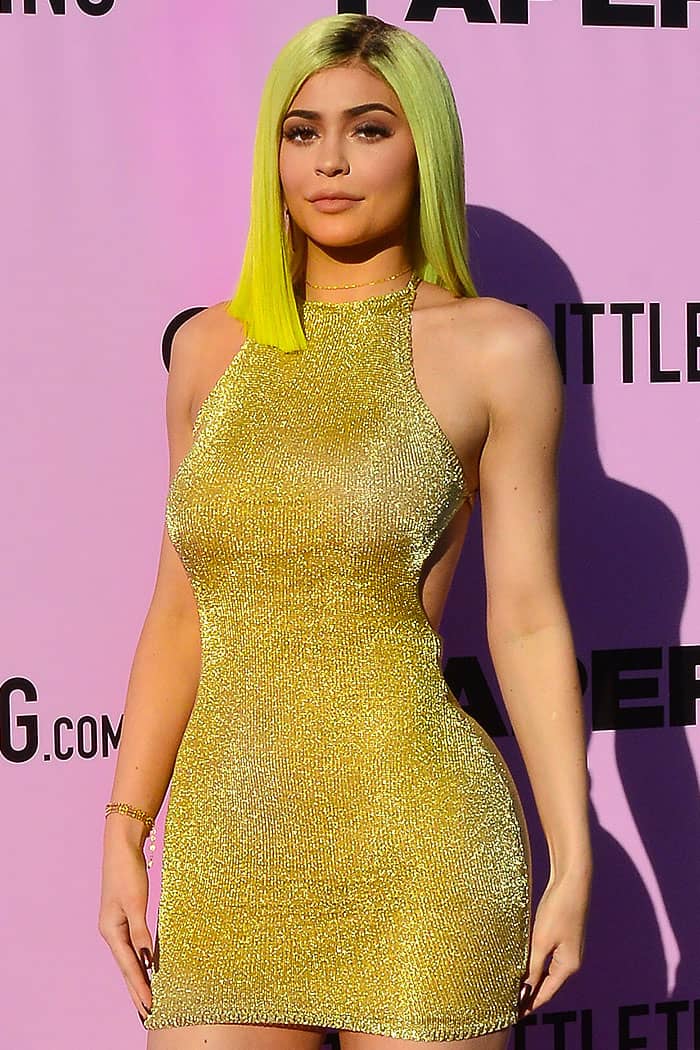 Kylie Jenner wearing a gold PrettyLittleThing “Charlay” knit dress