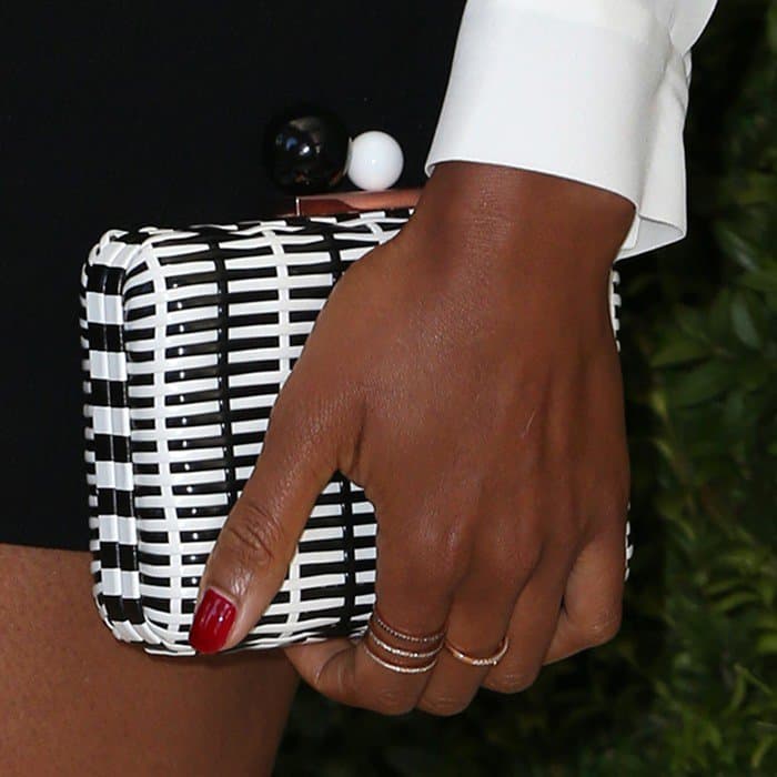 Naomie Harris carrying a monochrome woven leather minaudiere with ball clasp from Sophia Webster