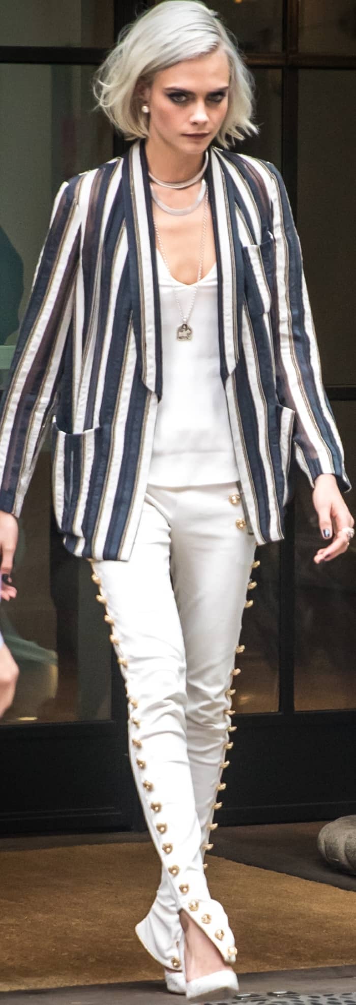 Cara Delevingne wearing a Brunello Cucinelli blazer, J Brand tank, Redemption skinny jeans, and Olgana Paris pumps in NYC