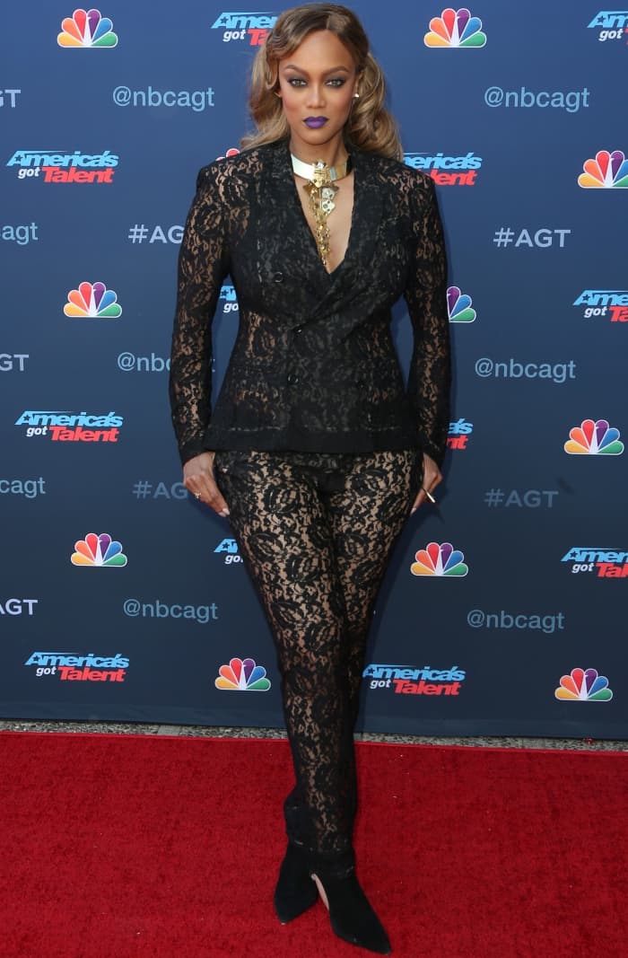 Tyra Banks wearing a sheer black lace ensemble with black booties at the "America's Got Talent" Season 12 Kickoff