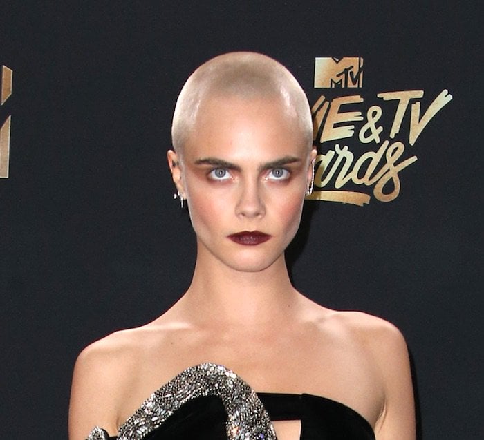 Cara Delevingne in head-to-toe Saint Laurent for the MTV Movie & TV Awards on May 7, 2017 at the Shrine Auditorium in Los Angeles