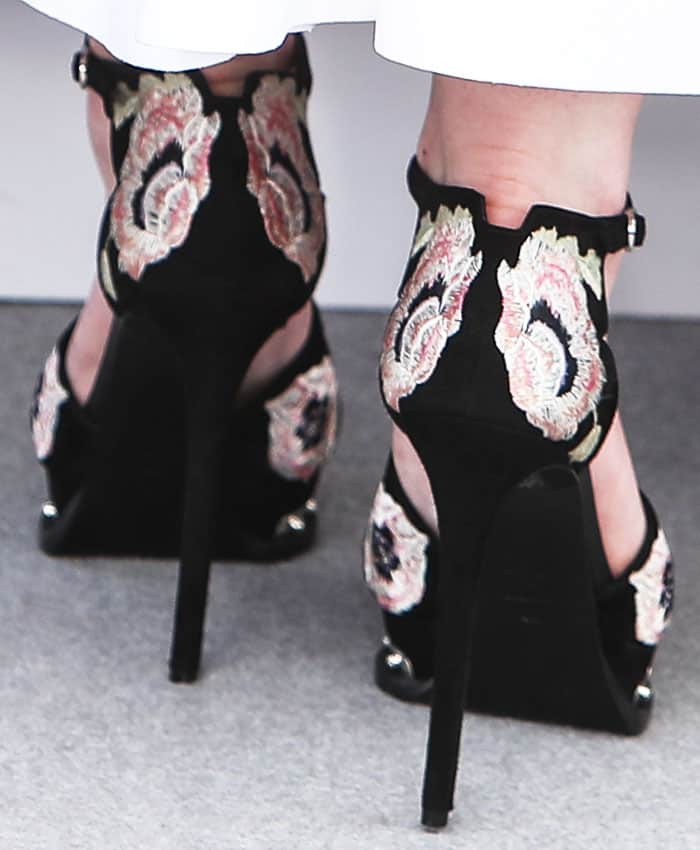 Eyes on the ground: Elle drew attention to her gorgeous embroidered Alexander McQueen suede platform sandals