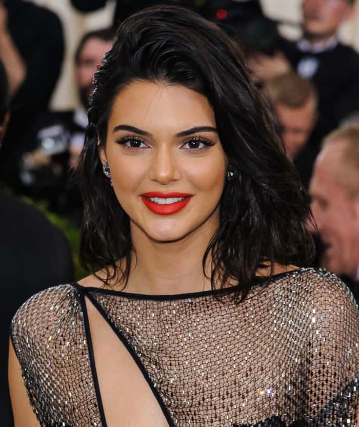 Kendall Jenner styled the barely-there dress with a painted macramé bodysuit