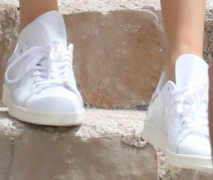 The model roughs up her Adidas 'Stan Smith' sneakers to make them summer-ready
