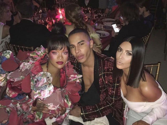 Kim poses with friend Olivier Rousteing and "the baddest" pop icon Rihanna