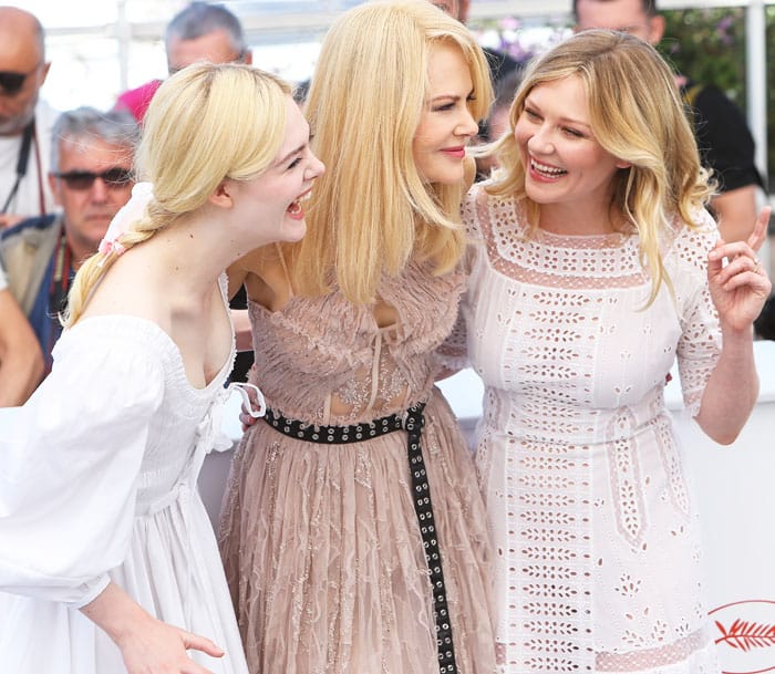 Kirsten shares a hearty laugh with her co-stars Nicole Kidman and Elle Fanning