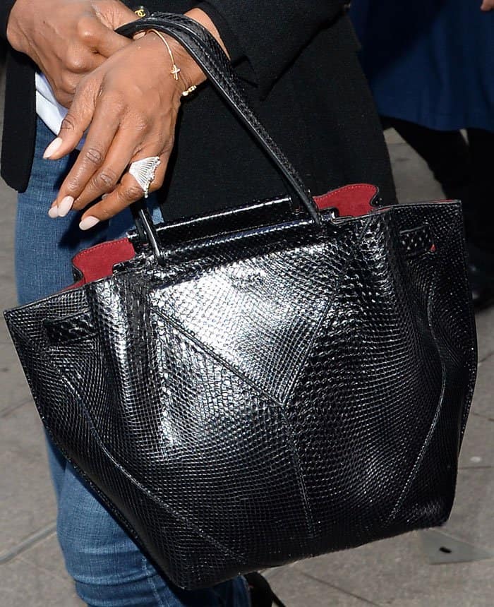 Naomi keeps things chic and casual with a reptile embossed leather tote