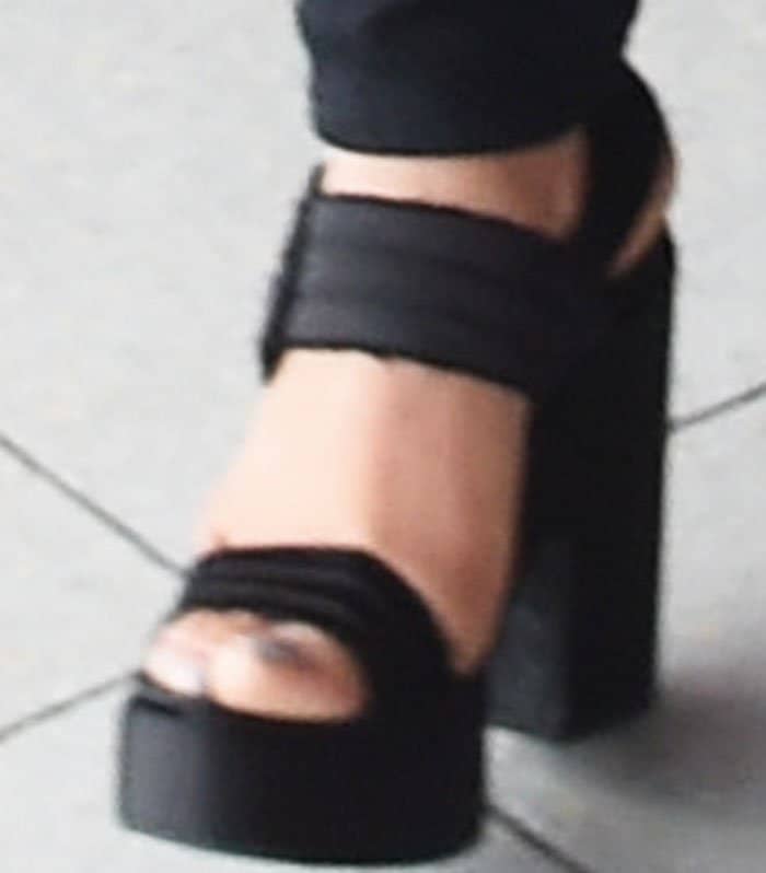 The actress towered in a pair of double strap platform sandals