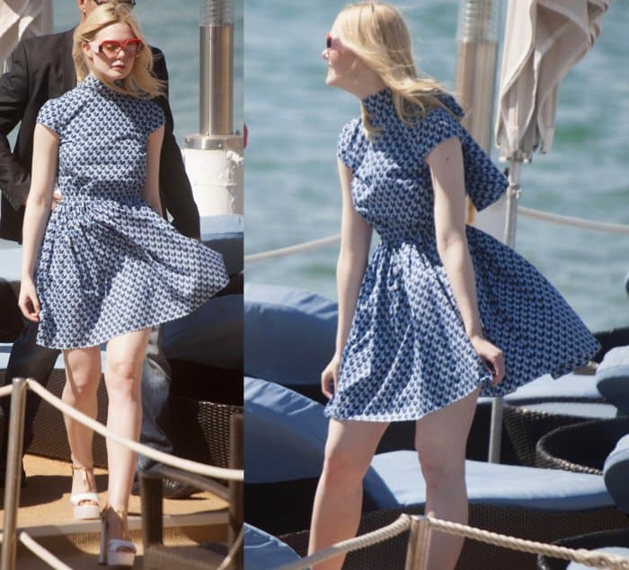 Elle Fanning wearing a Miu Miu dress and platform sandals while out and about in Cannes, France