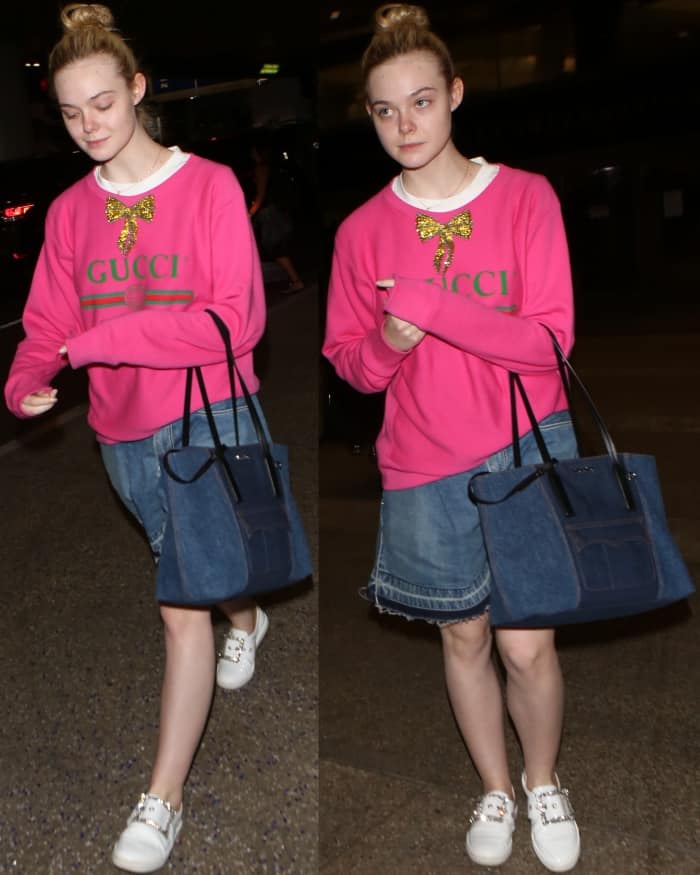 Elle Fanning wearing a Gucci logo sweatshirt, Sacai denim flared shorts, and Maison Margiela embellished buckle sneakers at LAX