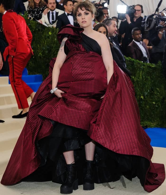 Lena Dunham wearing a custom Elizabeth Kennedy gown and Jeffrey Campbell lace-up boots at the 2017 Met Gala