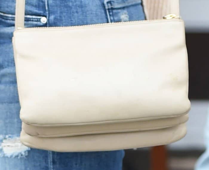 Jenna matches her shoes and top with a similarly colored Céline "Trio" bag