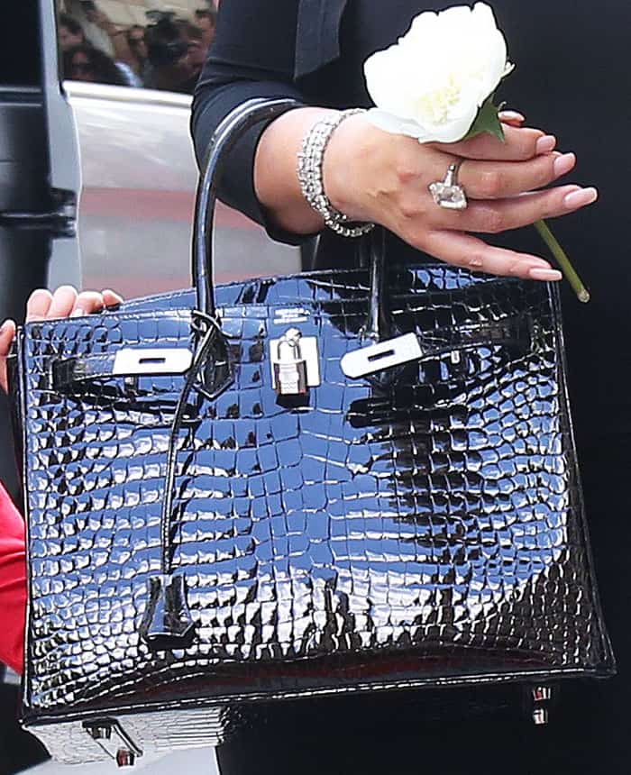 Mariah goes classic with an Hermés "Birkin" tote in patent crocodile pattern leather