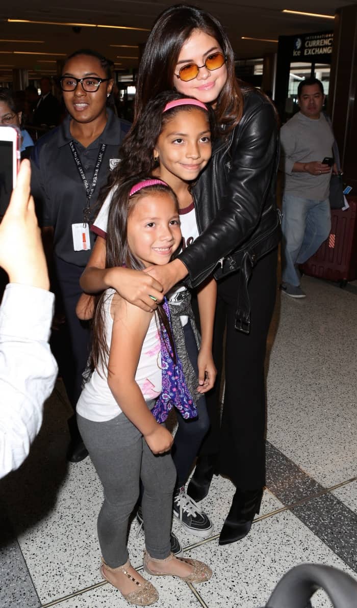 Selena Gomez with fans at LAX